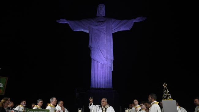 People attend a church service at the Christ the Redeemer statue at the Corcovado mountain as part of the New Year celebrations in Rio de Janeiro, Brazil. Picture: AFP