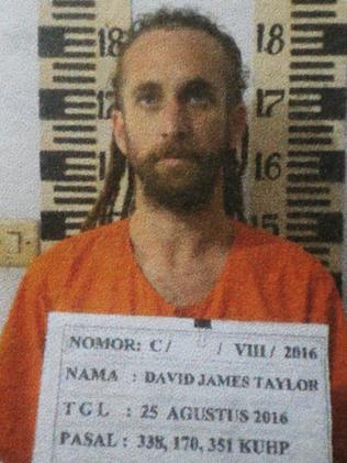 Dreadlocked David Taylor in his mugshot after the pair were arrested. Picture: Supplied