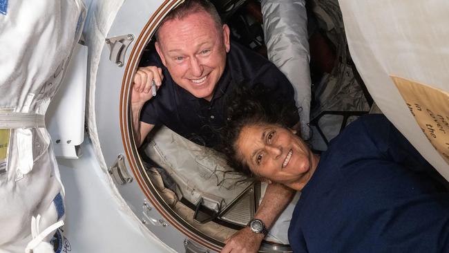 This undated handout picture from Nasa released on July2, 2024 shows NASAâs Boeing Crew Flight Test astronauts (from top) Butch Wilmore and Suni Williams inside the vestibule between the forward port on the International Space Stationâs Harmony module and Boeing's Starliner spacecraft. The first astronauts to fly Boeing's troubled Starliner are definitely not "stranded" at the International Space Station, NASA insisted on June 28, 2024 despite having no clear timeframe for bringing them home. In an unusually defensive press call, officials attempted to put a positive spin on where things currently stood after weeks of negative headlines due to the spaceship's delayed return. (Photo by Handout / NASA / AFP) / RESTRICTED TO EDITORIAL USE - MANDATORY CREDIT "AFP PHOTO / NASA" - NO MARKETING NO ADVERTISING CAMPAIGNS - DISTRIBUTED AS A SERVICE TO CLIENTS