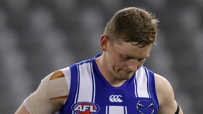 MELBOURNE, AUSTRALIA - AUGUST 14: Jack Ziebell of the Kangaroos looks dejected after a loss during the 2021 AFL Round 22 match between the North Melbourne Kangaroos and the Sydney Swans at Marvel Stadium on August 14, 2021 in Melbourne, Australia. (Photo by Michael Willson/AFL Photos via Getty Images)