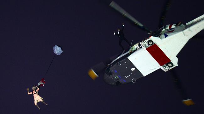 An actor dressed to resemble Britain’s Queen Elizabeth II parachutes into the stadium during the opening ceremony of the London 2012.