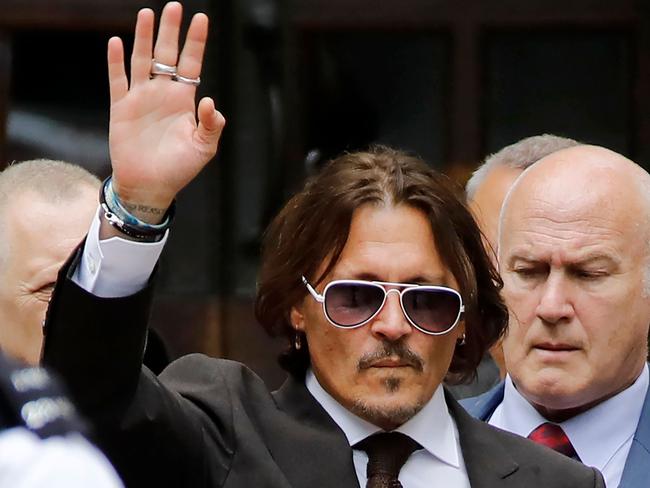 US actor Johnny Depp waves as he leaves after the fourth day of his libel trial at the High Court in London. Picture: AFP