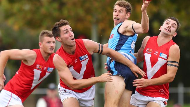 North Adelaide players wear black armbands in April after the death of trainer Vaughan Taylor. Picture: Tait Schmaal