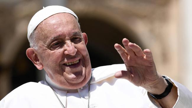 Pope Francis greets people at the end of the weekly audience at St Peter's square in The Vatican. Picture: AFP.