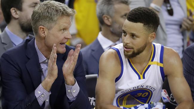 Golden State Warriors head coach Steve Kerr, pictured speaking with star Steph Curry, has sarcastically responded to past players belief that they could have beaten his Warriors. Picture: AP