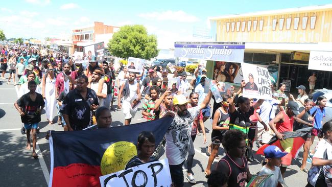 Indigenous protesters march through the streets of Mareeba in response to a police shooting on Saturday. Picture: Peter Carruthers