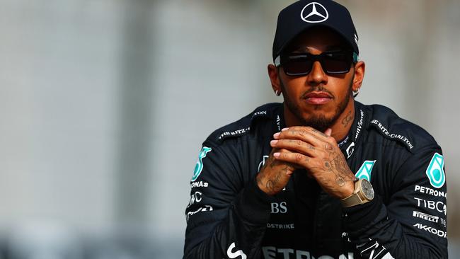 ABU DHABI, UNITED ARAB EMIRATES – NOVEMBER 20: Lewis Hamilton of Great Britain and Mercedes looks on ahead of the F1 2022 End of Year photo prior to the F1 Grand Prix of Abu Dhabi at Yas Marina Circuit on November 20, 2022 in Abu Dhabi, United Arab Emirates. (Photo by Mark Thompson/Getty Images)