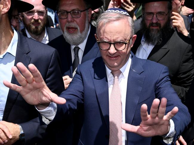 Prime Minister Anthony Albanese leaves after visiting the Adass Israel Synagogue after a firebombing in Melbourne, Tuesday, December 10, 2024. (AAP Image/Joel Carrett) NO ARCHIVING