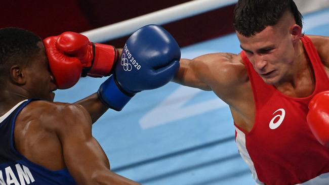 Harrison Garside and Namibia's Jonas Jonas fight during their men's light round of 16 bout. Picture: AFP