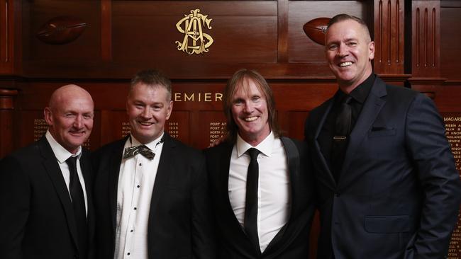 Peter Motley, second from left, with fellow SA Football Hall of Fame inductee Greg Anderso, third from left, with their special guests Craig Bradley and Paul Salmon. Picture: MATT LOXTON