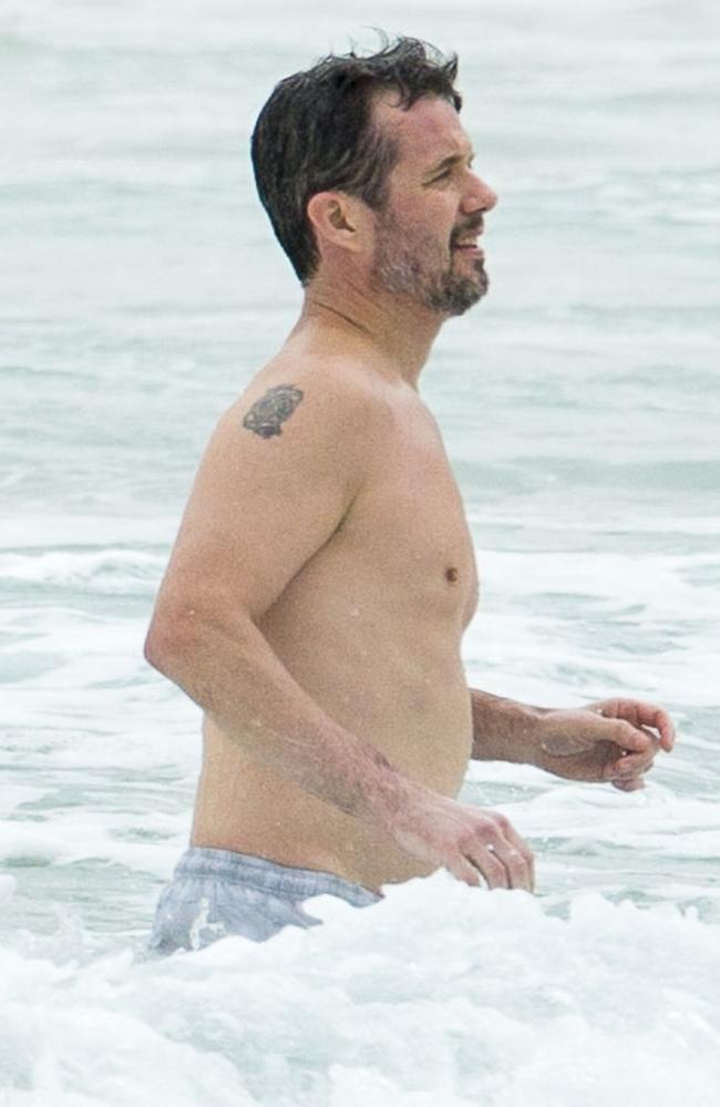 Prince Frederik had his shoulder tatt on display. Princess Mary and her royal family hit Sydney’s Palm Beach for a dip before they head to Tasmania for an Aussie Christmas. Picture: Media Mode