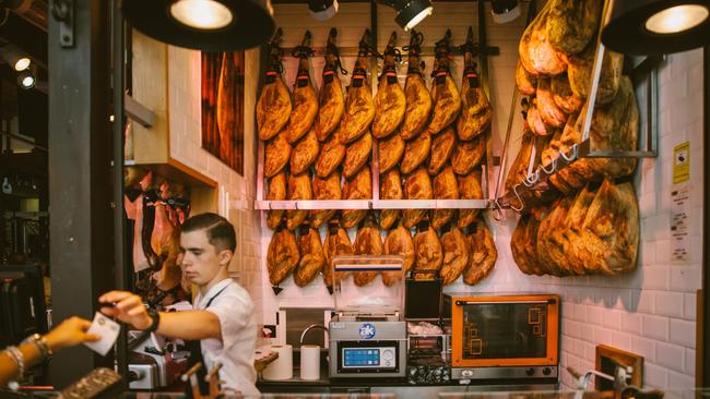 Buying ham at San Miguel Market in Madrid.