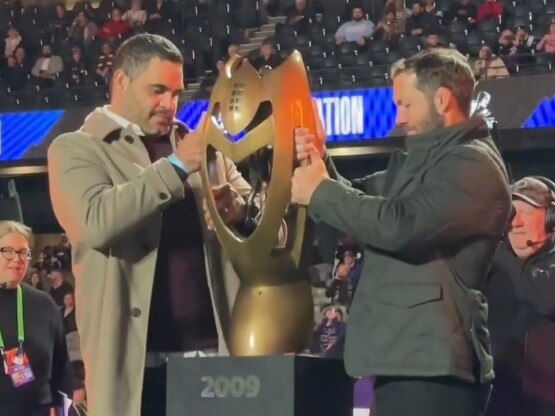 The Melbourne Storm show off their 2009 premiership trophy.