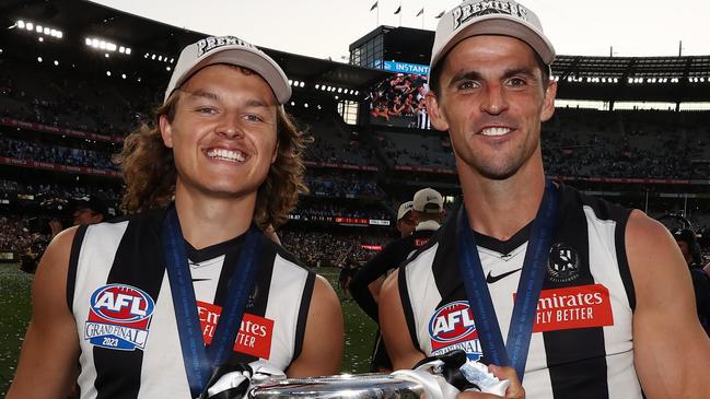 MELBOURNE , AUSTRALIA. September 30, 2023. AFL Grand Final between Collingwood and the Brisbane Lions at the MCG.  Scott Pendlebury and Jack Ginnivan of the Magpies   .Picture by Michael Klein