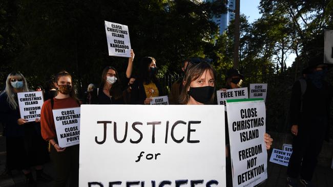 BRISBANE, AUSTRALIA, AUGUST 18, 2020 - Protesters hold signs during a rally before marching through central Brisbane to oppose the expansion/reopening of the Christmas Island detention centre and to call for all refugees and asylum seekers to be released into the community. (NCA NewWire/Dan Peled)