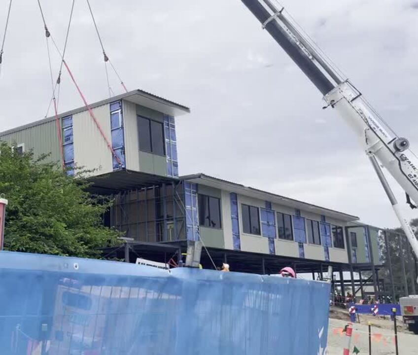 The final piece of the Hervey Bay Hospital modular medical ward is craned in.