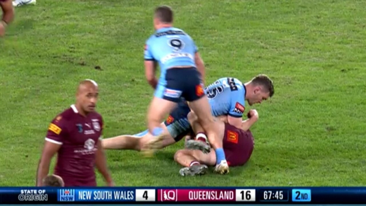 Martin digs his elbow into Cameron Munster’s ribs during Origin 1.