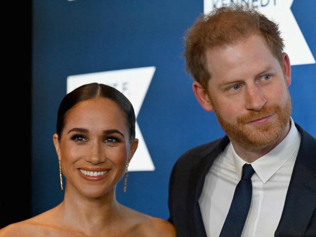 (FILES) Prince Harry, Duke of Sussex, and Meghan, Duchess of Sussex, arrive at the 2022 Robert F. Kennedy Human Rights Ripple of Hope Award Gala at the Hilton Midtown in New York City on December 6, 2022. Prince Harry and wife Meghan Markle were involved in a "near catastrophic car chase" involving paparazzi in New York late on May 16, 2023, a spokesperson for the couple said May 17. "This relentless pursuit, lasting over two hours, resulted in multiple near collisions involving other drivers on the road, pedestrians and two NYPD officers," the spokesperson added. (Photo by ANGELA WEISS / AFP)