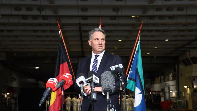 Defence Minister Richard Marles prepares to speak as he stands aboard the Australian Navy ship HMAS Canberra in Sydney. Picture: DAVID GRAY / AFP