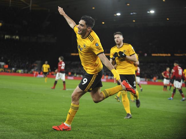 Wolverhampton's Raul Jimenez celebrates after scoring his side's opening goal during the English FA Cup Quarter Final soccer match between Wolverhampton Wanderers and Manchester United at the Molineux Stadium in Wolverhampton, England, Saturday, March 16, 2019. (AP Photo/Rui Vieira)