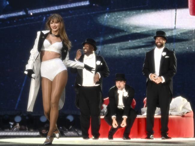 Swift looks giddy as Travis looks on proudly. Picture: Gareth Cattermole/TAS24/Getty Images for TAS Rights Management