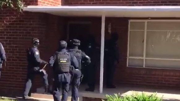 Police raid a home in Sydney’s west.