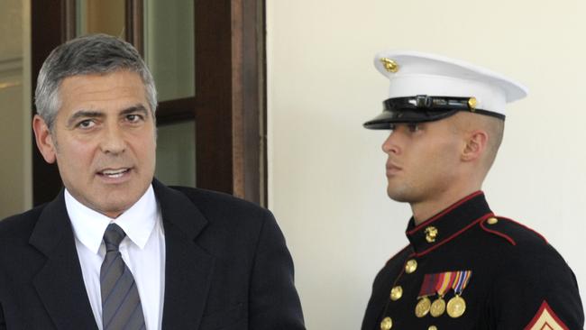 George Clooney walks out of the West Wing to speak to reporters after meeting with Barack Obama about a recent trip to Sudan in 2010. Picture: AP