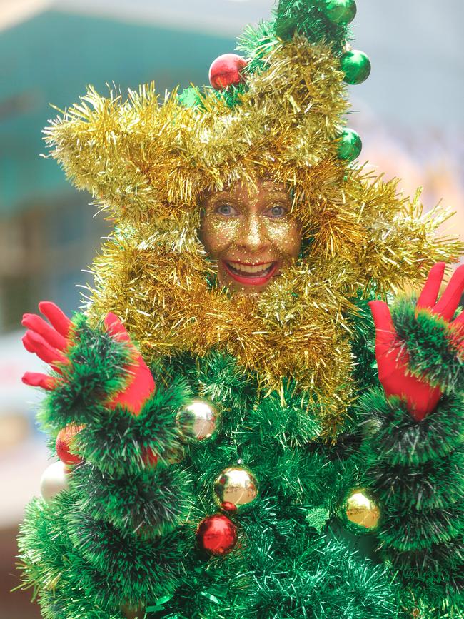 A walking Xmas Tree in the annual Christmas Pageant and Parade down the Esplanade and Knuckey Streets. Picture: Glenn Campbell