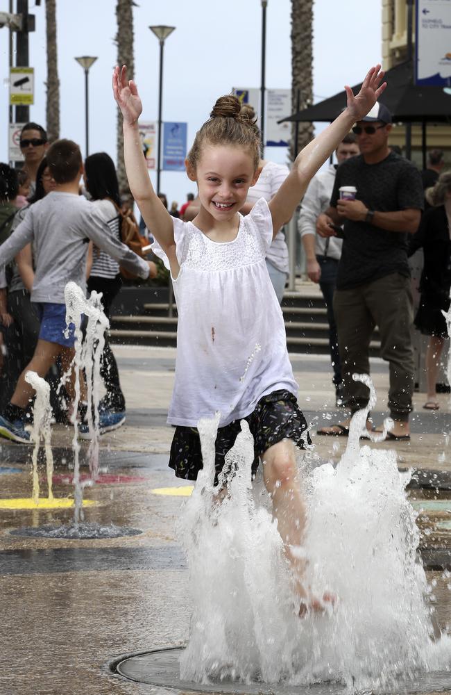 Henrietta, 6, from Brighton, enjoying the fountain at Glenelg. Picture: Sarah Reed