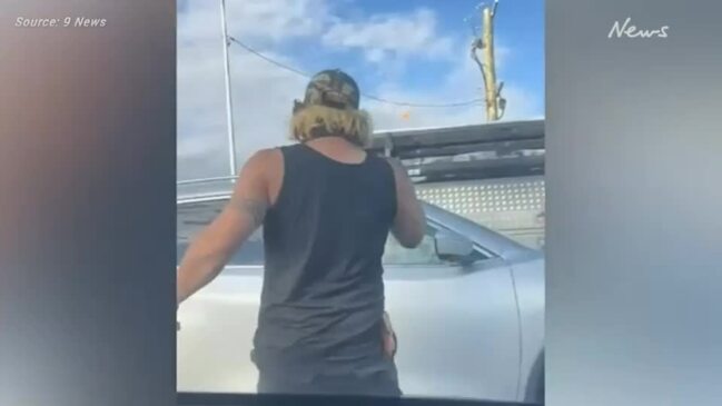 Man smashes window of woman's car in road rage attack in Logan