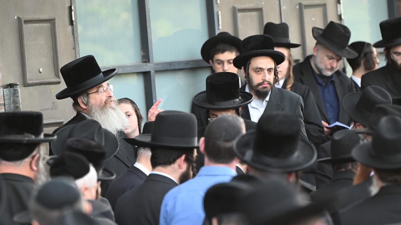 The firebombed Adass Israel Synagogue in Ripponlea, Melbourne, holds a ceremony where Rabbi Kohn blesses some of the items that were burned in the fire. Picture: Tony Gough