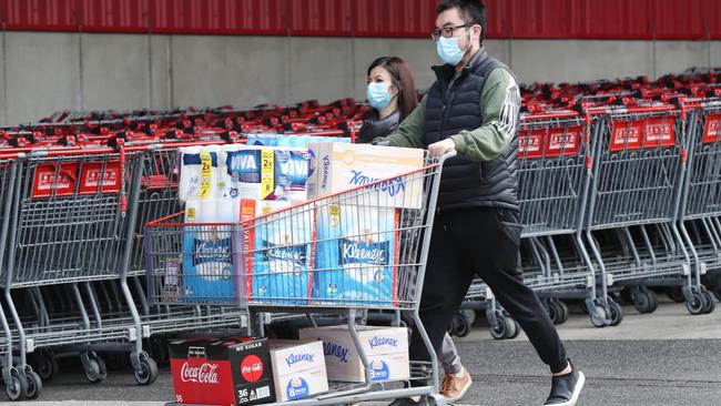 People load up with supplies at Costco as another lockdown is announced in Melbourne. Picture: David Crosling