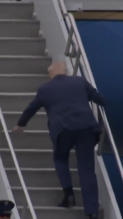 Donald Trump trips while attempting to board Air Force One