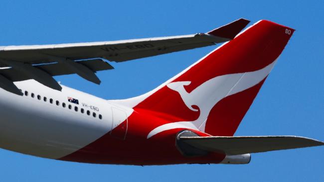 SYDNEY, AUSTRALIA - FEBRUARY 22: The tail of a Qantas plane is seen at take off from Sydney International Airport on February 22, 2024 in Sydney, Australia. Qantas has demonstrated a significant financial turnaround, reporting a record $2.47 billion profit for the 2022-23 fiscal year, marking a stark change from the previous year's $1.86 billion loss. The airline's strong performance was attributed to robust travel demand and high ticket prices, with domestic earnings before interest and taxes (EBIT) jumping to 18.2%, representing a 50% increase in profit margins over the past six years. The company's return on invested capital also increased to 103.6%, reflecting its improved financial position and operational performance. (Photo by Jenny Evans/Getty Images)