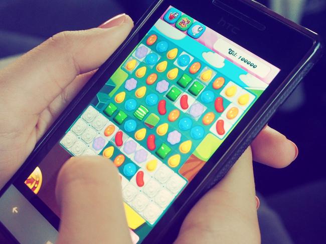 Person Playing Candy Crush on Nokia Smartphone, supplied by Beata Dudová via Pexels