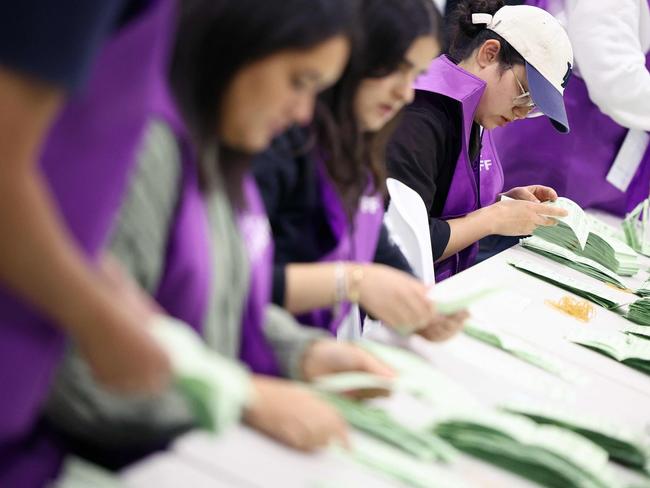 Australian Electoral Commission employees count ballots in Melbourne on May 3. Picture: AFP