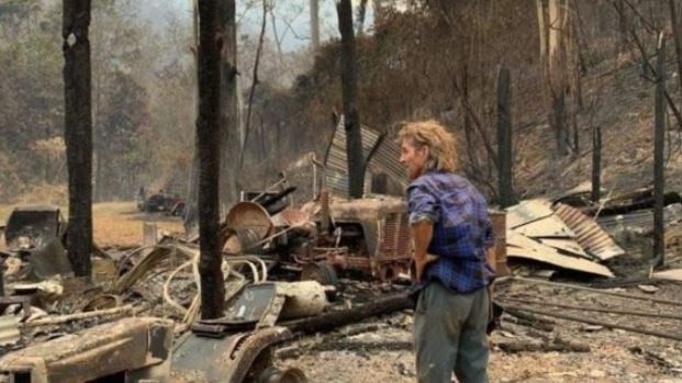 Trevor Bailey needs help to keep the fire near Bowraville from affecting his home.