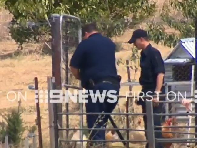 Police search a property near Young. Picture: Channel Nine