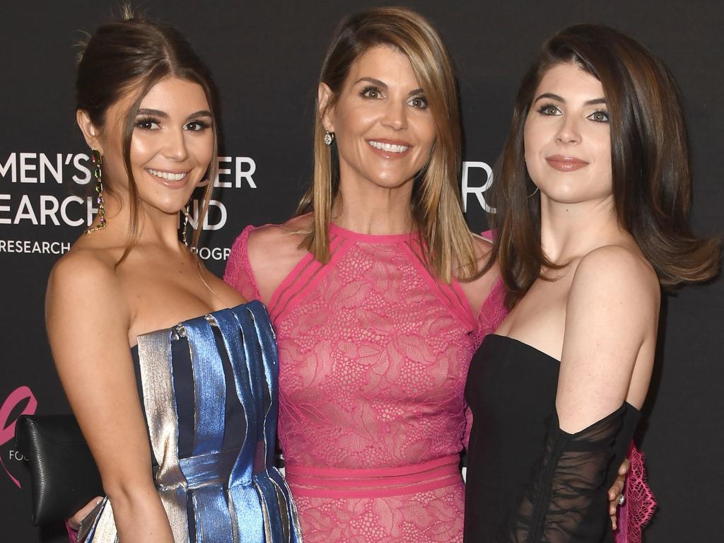 (L-R) Olivia Jade Giannulli, Lori Loughlin and Isabella Rose Giannulli. The two girls can’t drop out of uni despite allegations the parents gave bribes for them to attend. Picture: Frazer Harrison/Getty Images