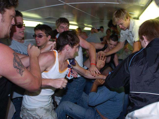 An angry mob enter a train at Cronulla Railway Station and bash two men of Middle Eastern appearance. Picture: Craig Greenhill