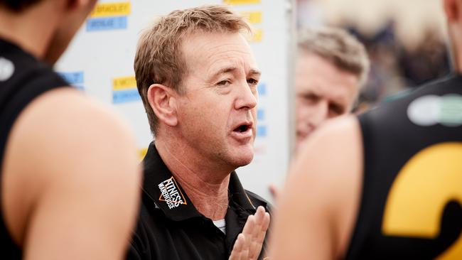 Glenelg Coach Mark Stone address his players during a 2018 game. Picture: AAP Image