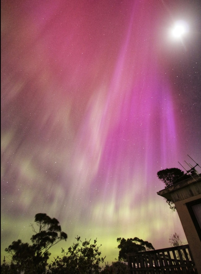 Bryan Chester capture this stunning image of aurora australis from Primrose Sands saying it first looked like huge white shafts of light, with his camera catching the colours. Image: Facebook.