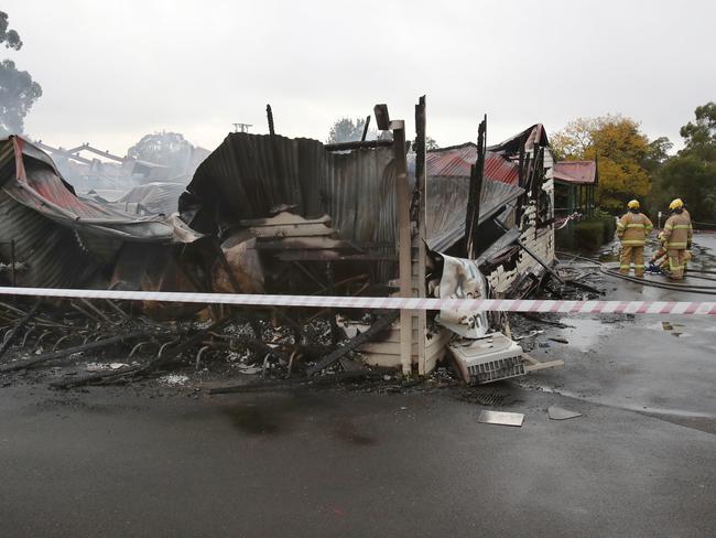 Firefighters and police at the scene of a fire that destroyed the Gisborne Golf Club. Picture: David Crosling