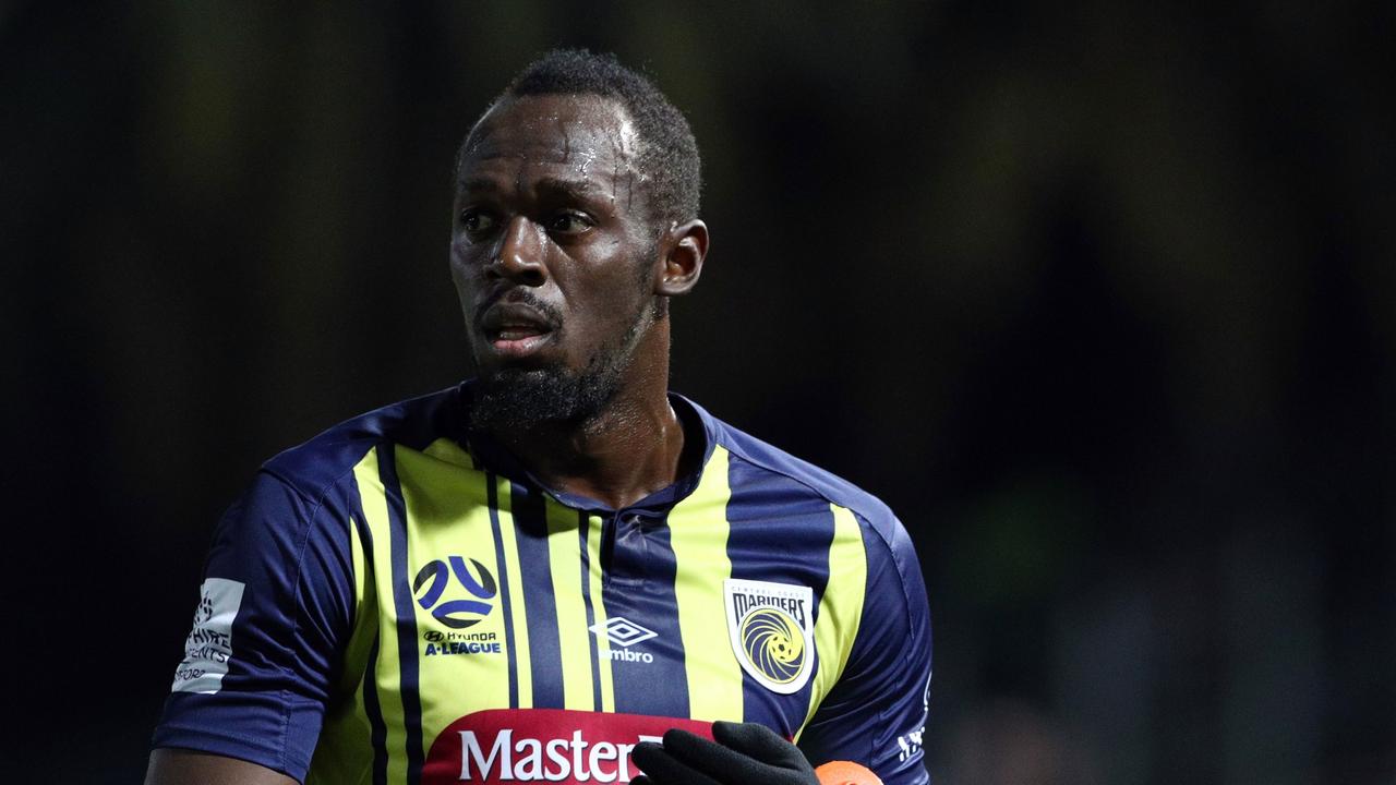 Olympic sprinter Usain Bolt gestures as he plays for A-League football club Central Coast Mariners