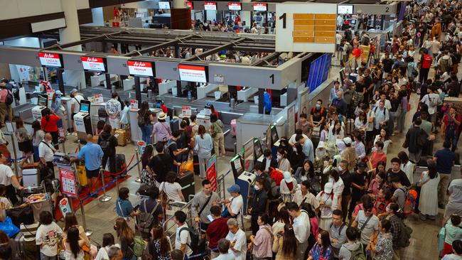Queues of passengers at the Air Asia check-in counters at Don Mueang Airport on July 20, 2024 in Bangkok, Thailand. Picture: Mailee Osten-Tan/Getty Images