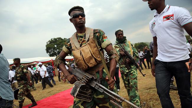 Elite military units keep guard as President Pierre Nkurunziza kicks off his official campaign for the presidency at a rally on June 25, 2015 in Busoni, Burundi. (Photo by Spencer Platt/Getty Images)