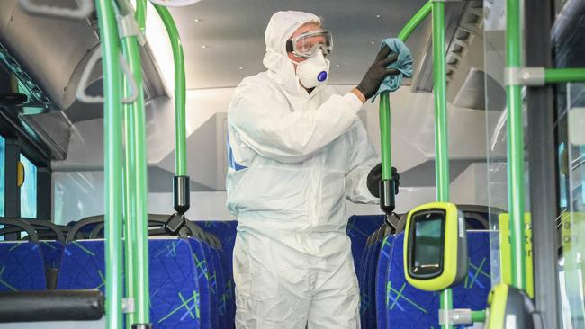 A buss is deep cleaned after a popular bus route was listed as an exposure site. Picture: NCA NewsWire / Wayne Taylor