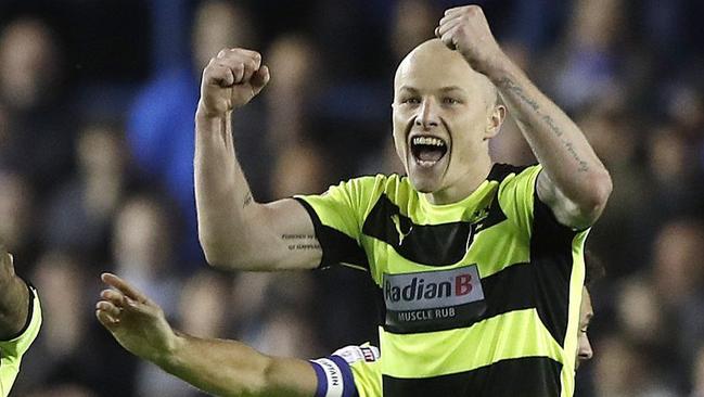 Socceroo Aaron Mooy celebrates after Huddersfield Town’s penalty shootout win over Sheffield Wednesday. Picture: AP