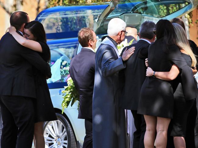 The coffin is placed in the hearse. Picture: The Australian