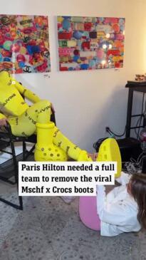 Paris Hilton grapples with taking off her MSCHF x Crocs Boots